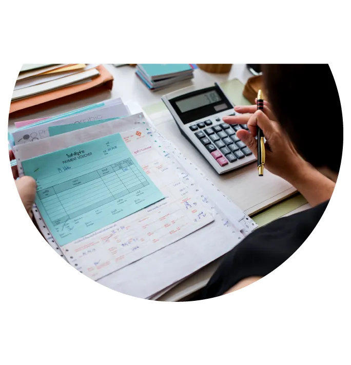 Employee Calculating Taxes